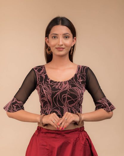 Model wearing a stretchable blouse featuring tonal zari flower appliqués, round neckline, and elbow sleeves