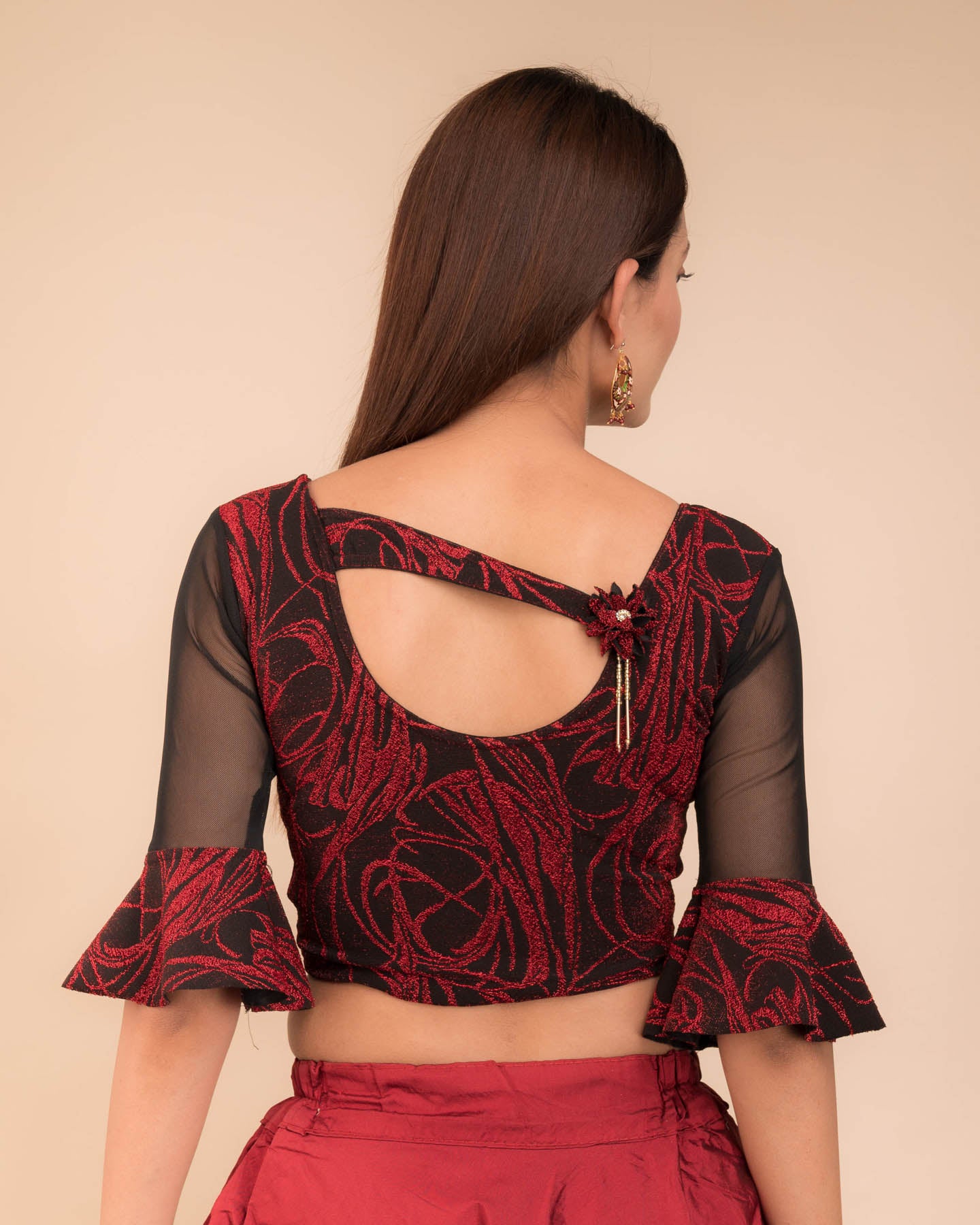  Rear view showcasing the appliqué detailing and back fit.