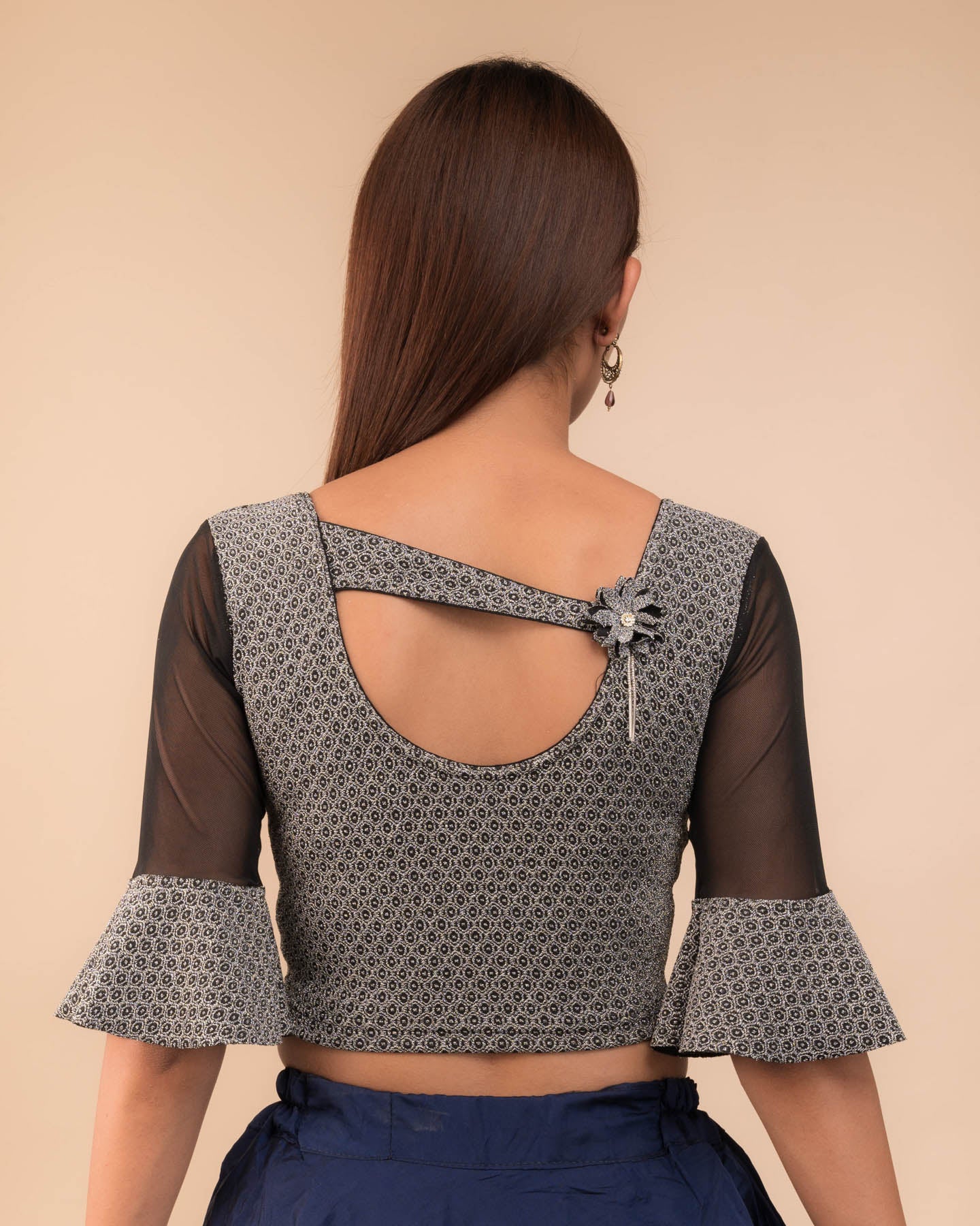  Rear view showcasing the appliqué detailing and back fit.