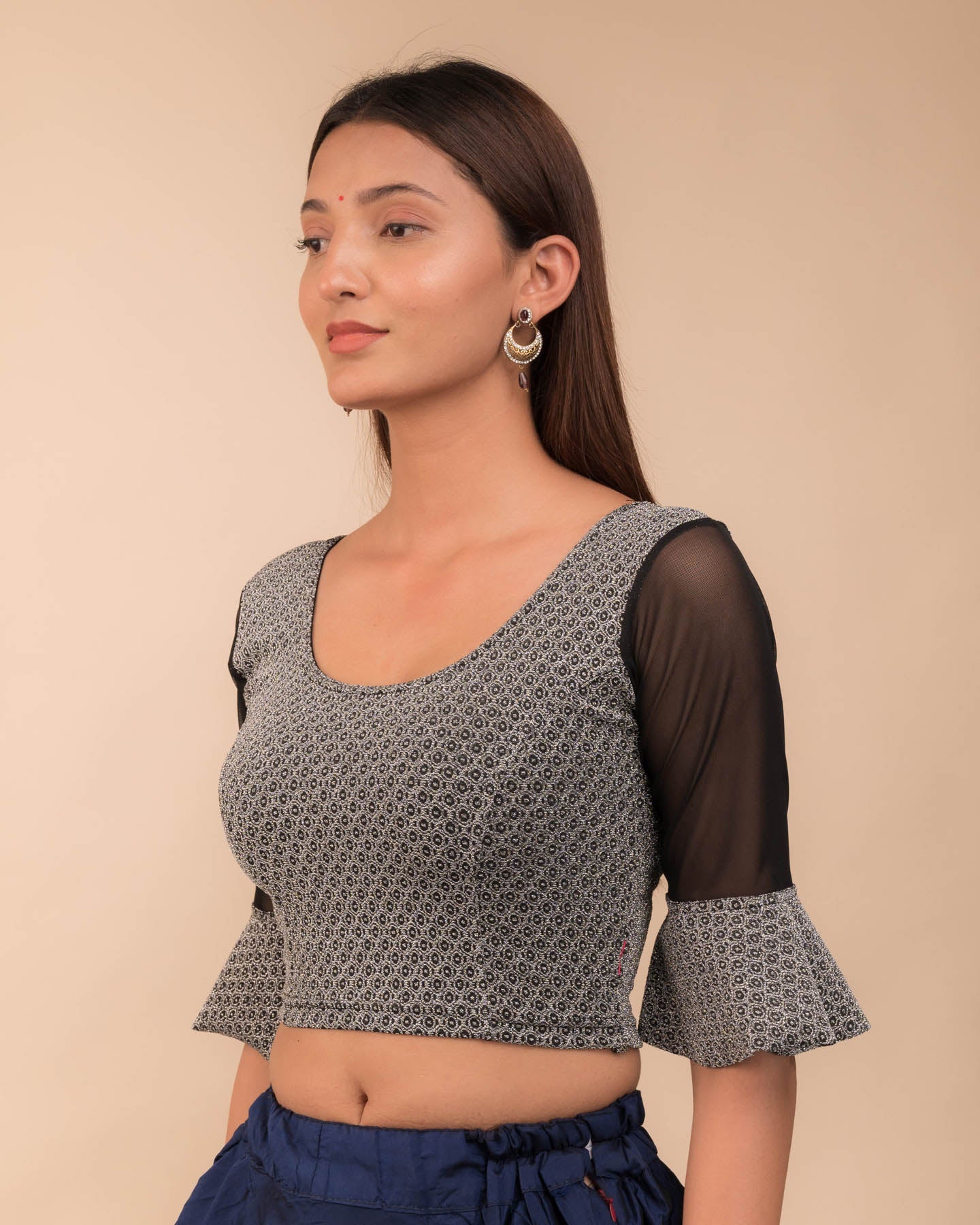 Side view highlighting the fit silhouette and sleeve length