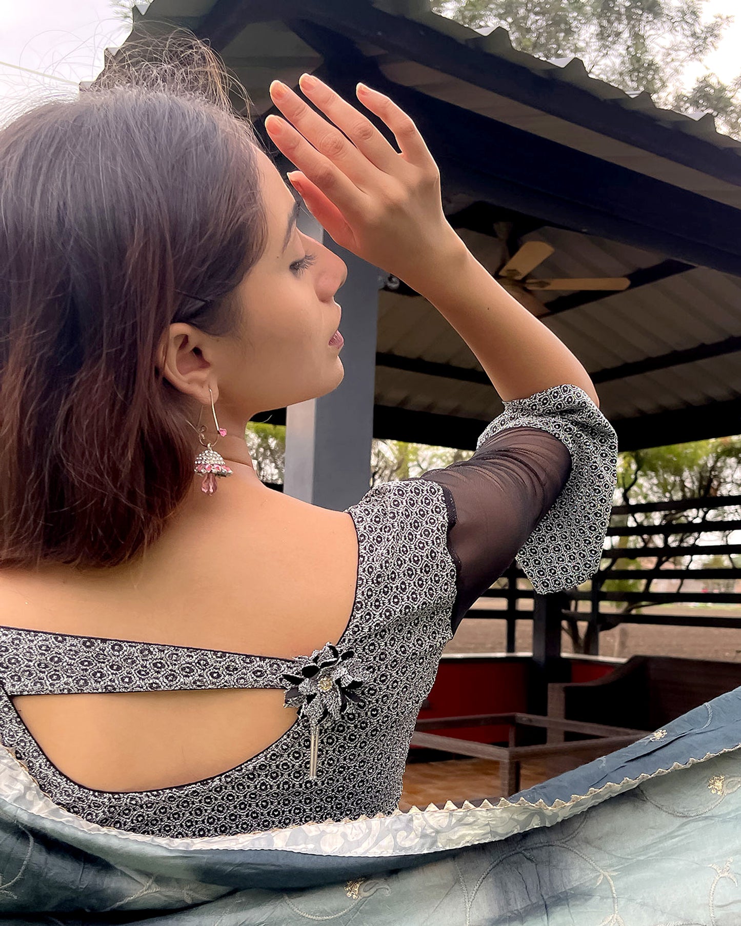 Model pairing the blouse with a saree for an elegant festive ensemble