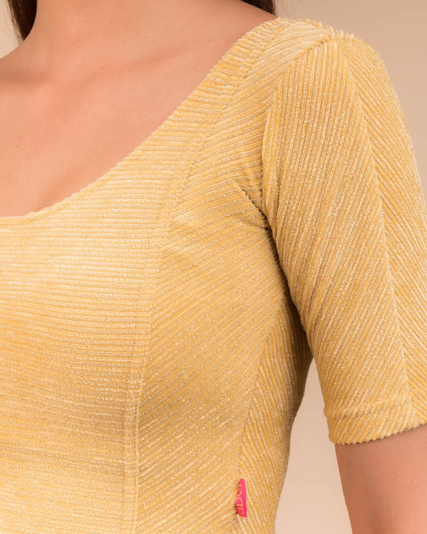 Close-up of the velvet fabric detailing the striped texture.