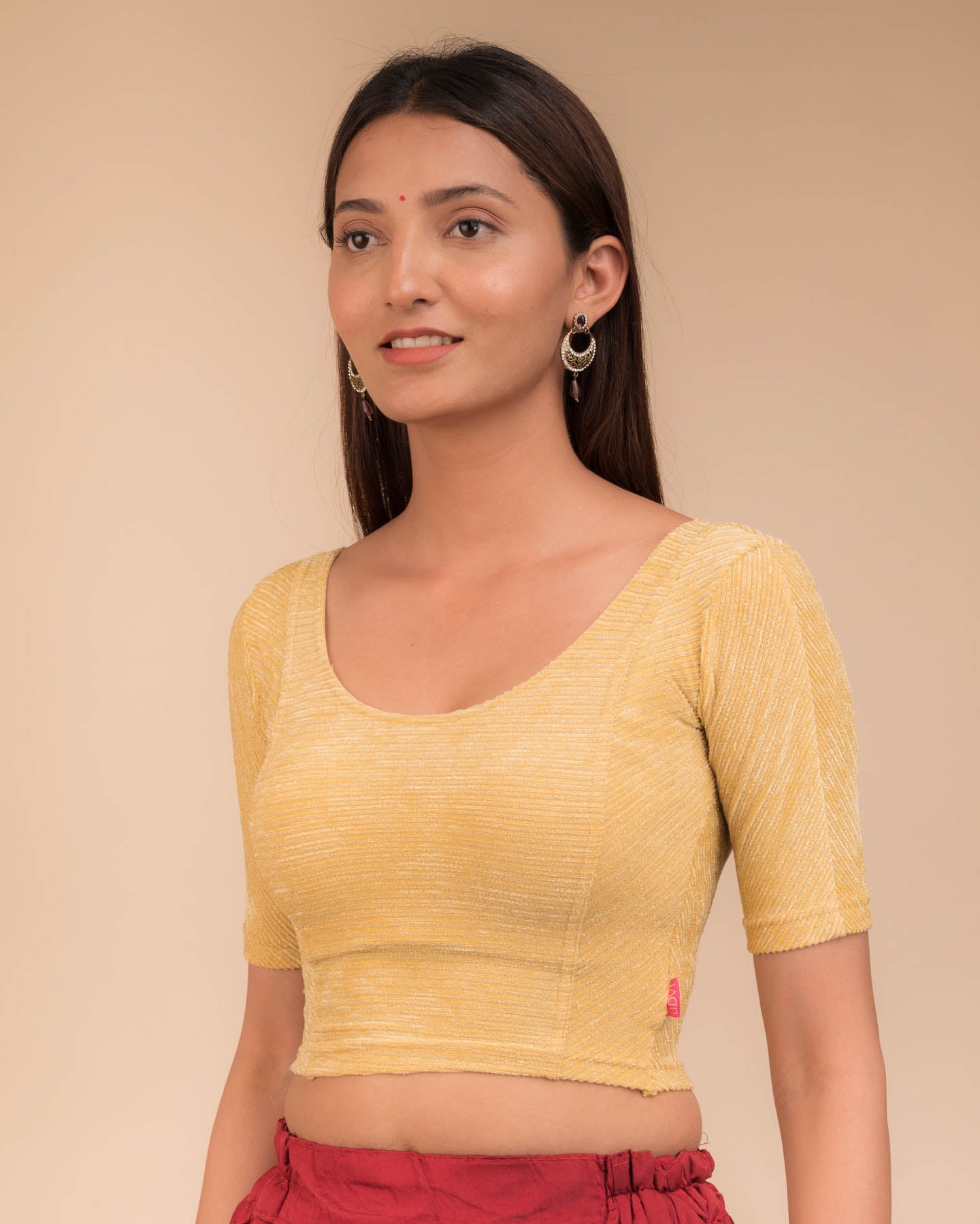Side profile of the stretchable blouse highlighting fit and sleeve structure.