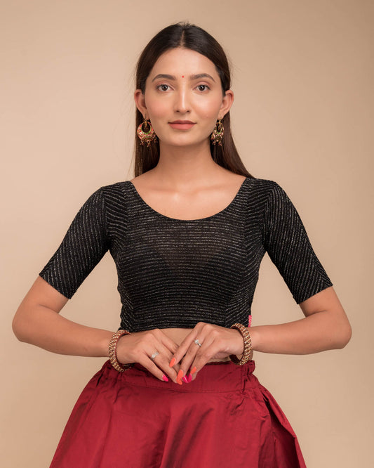 Model wearing a velvet stretchable blouse with elbow sleeves and round neckline, featuring metallic stripes.