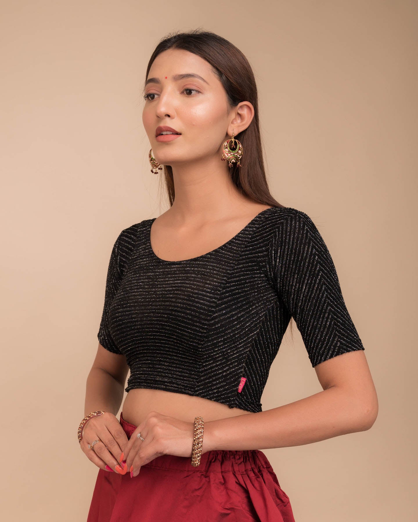 Side profile of the stretchable blouse highlighting fit and sleeve structure.