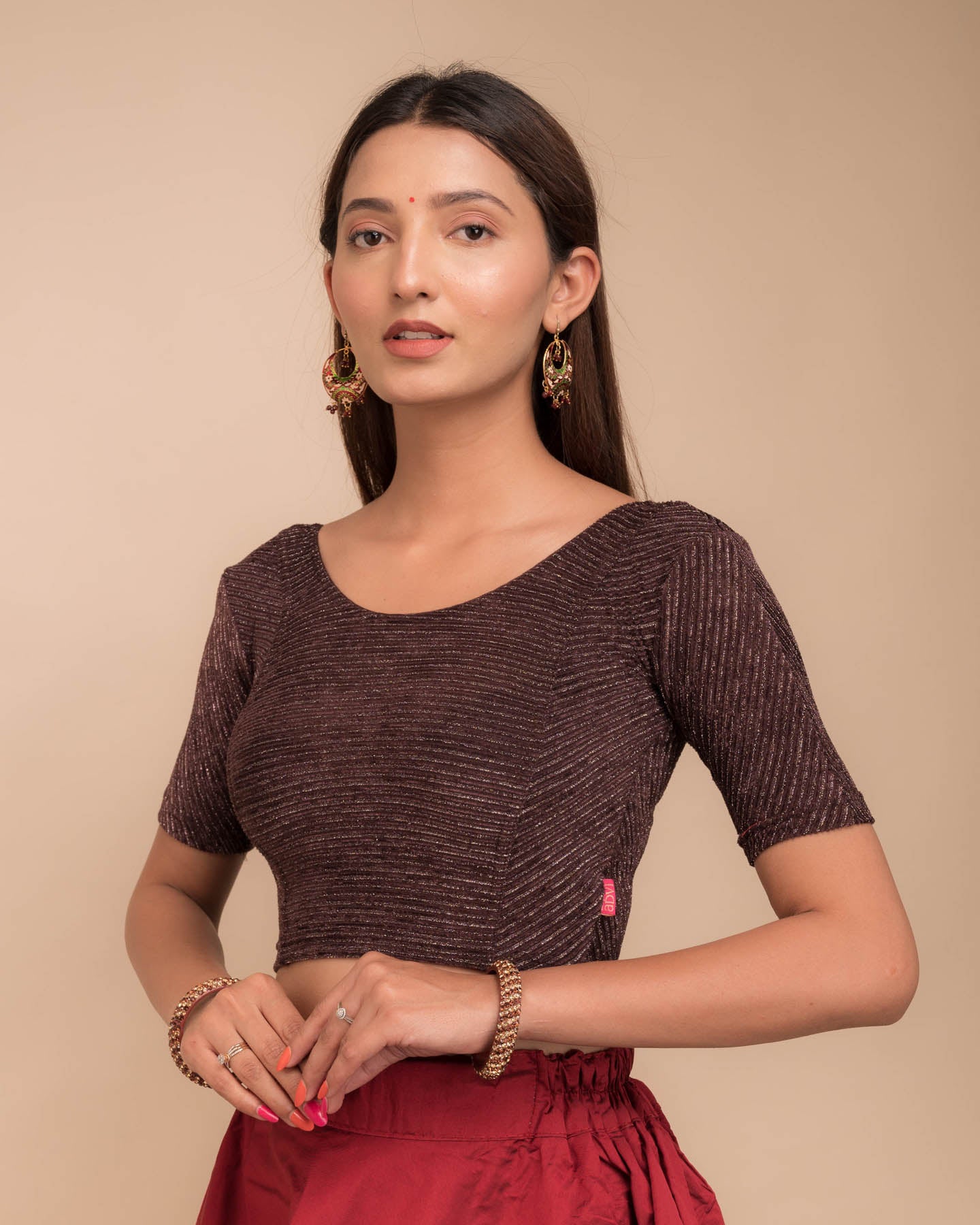 Side profile of the stretchable blouse highlighting fit and sleeve structure.