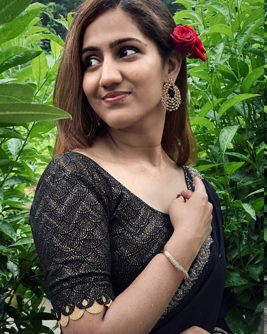 Model pairing the blouse with a saree for a festive look.