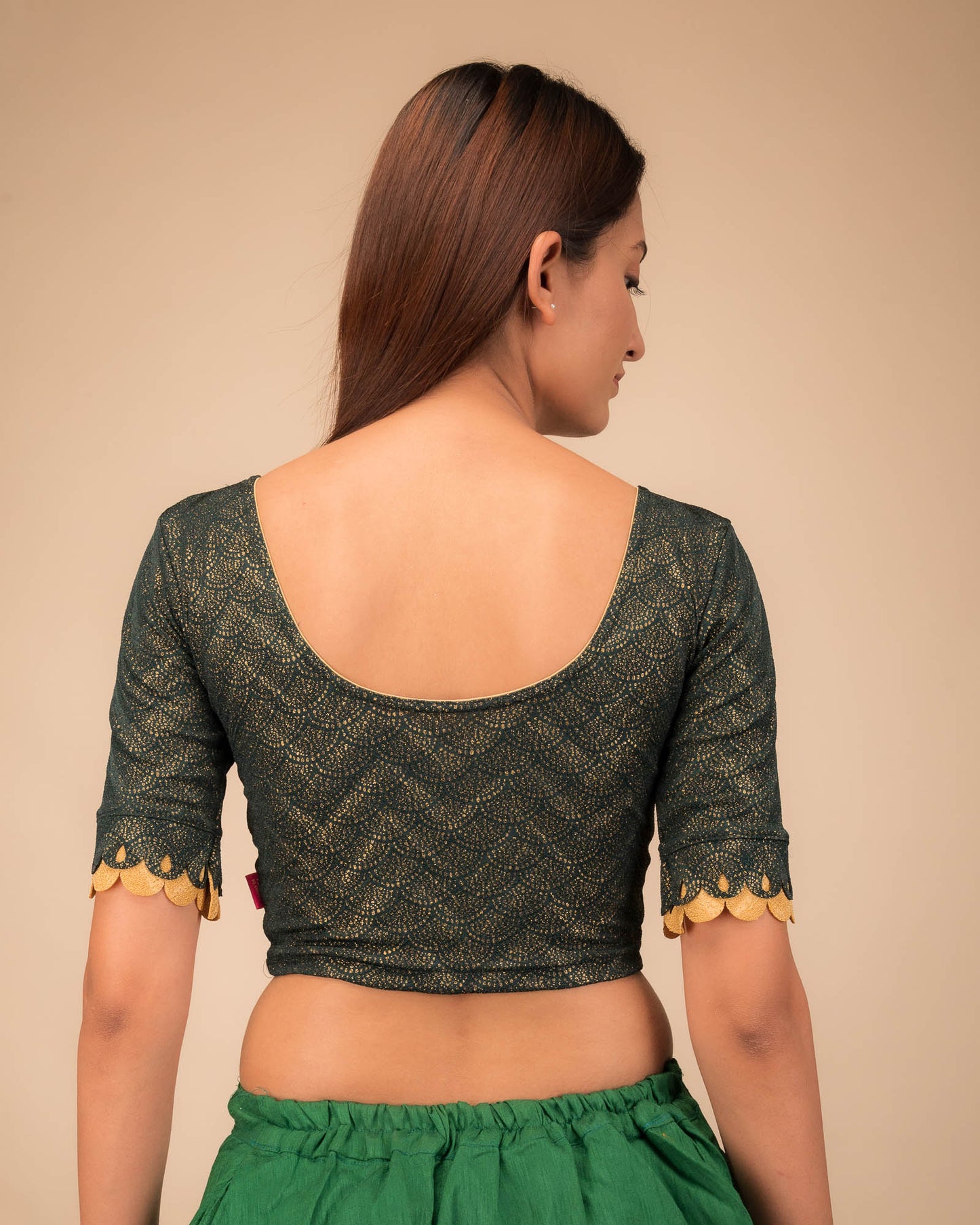 Rear view highlighting the scallop sleeve detail.