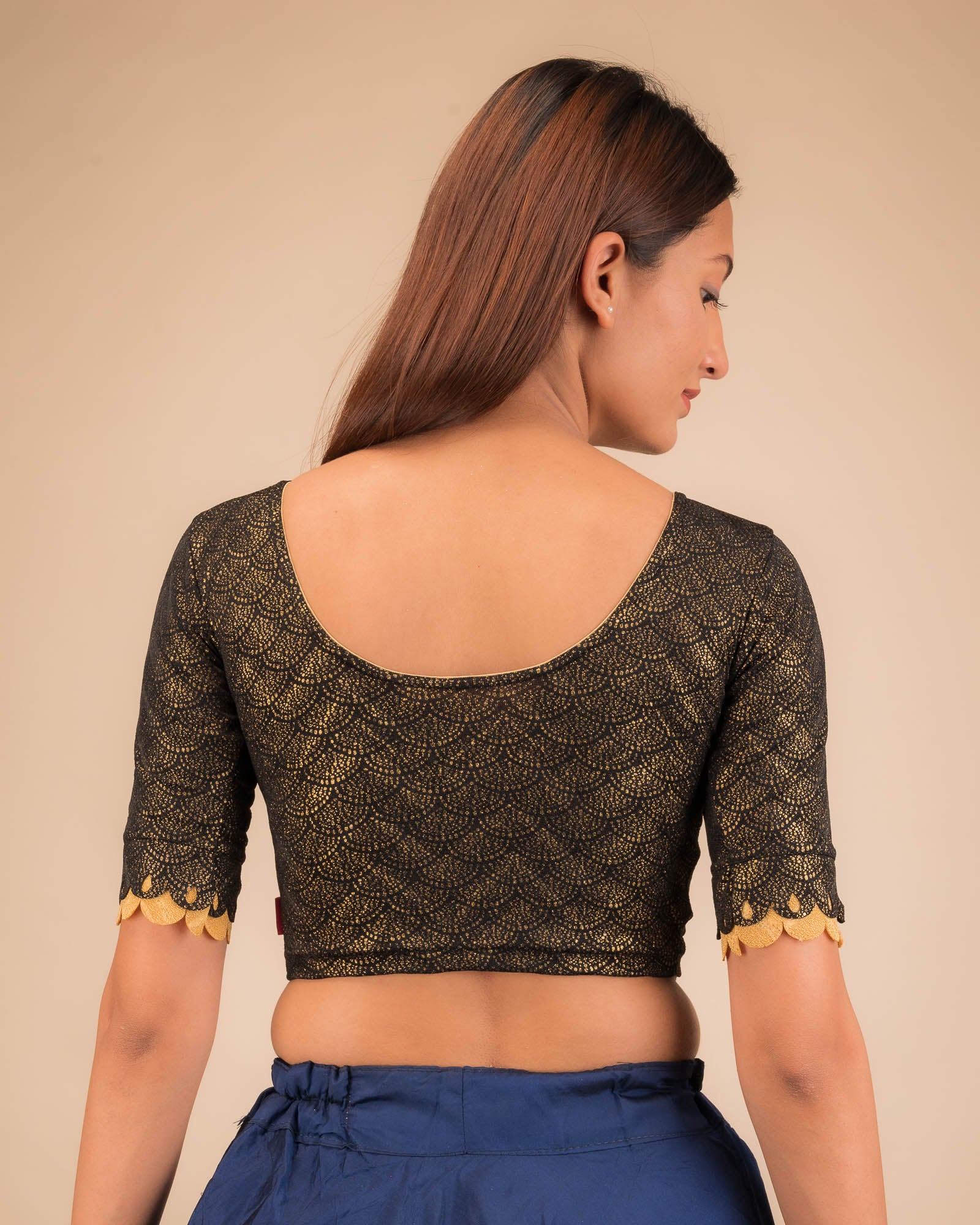Rear view highlighting the scallop sleeve detail.