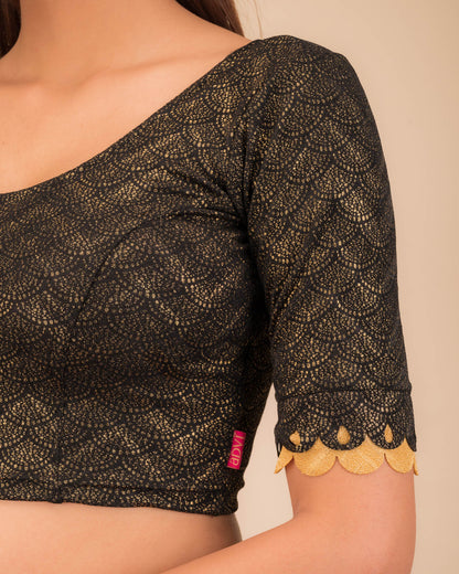 Close-up of the jacquard knit fabric with metallic scallop detailing.