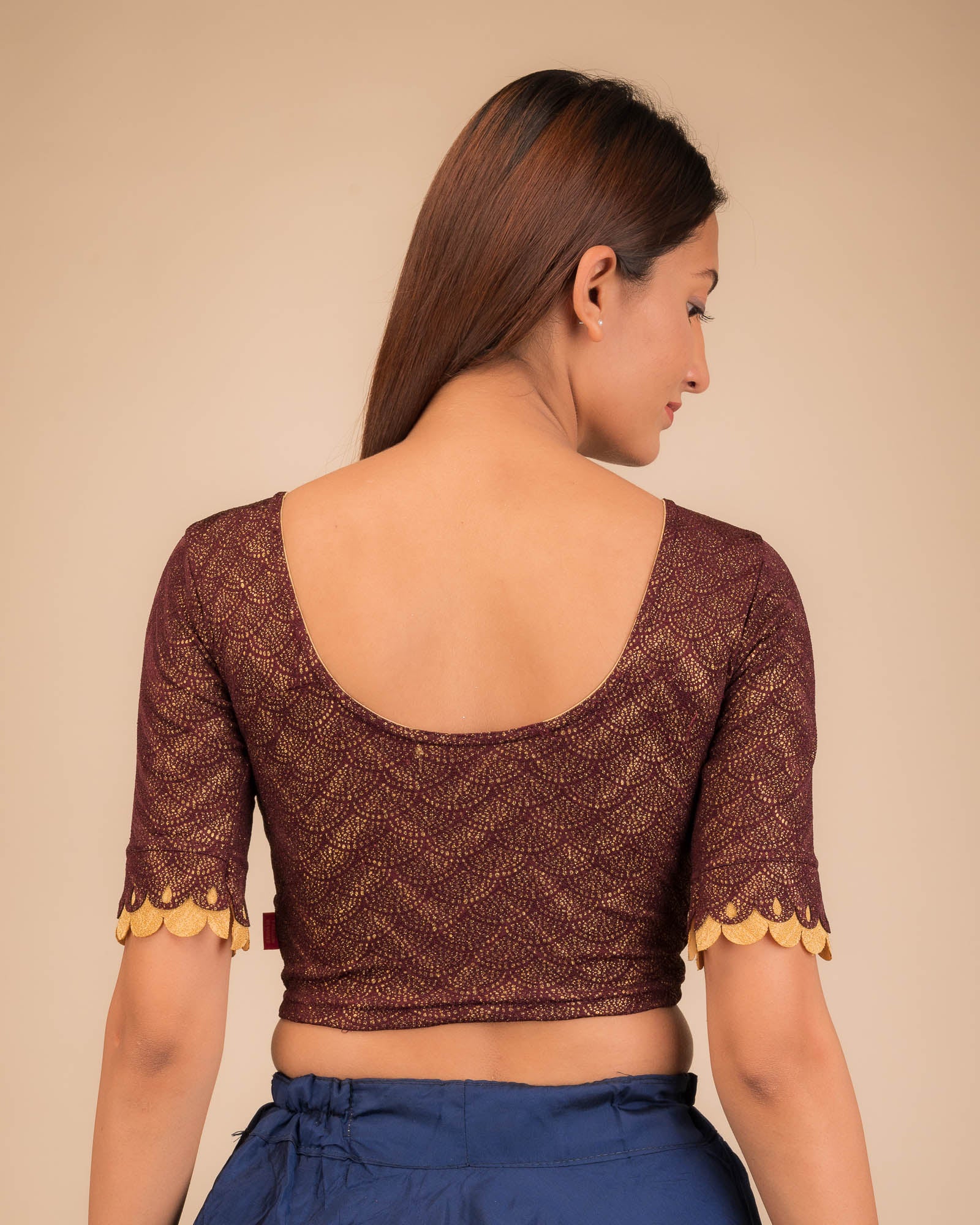 Rear view highlighting the scallop sleeve detail.