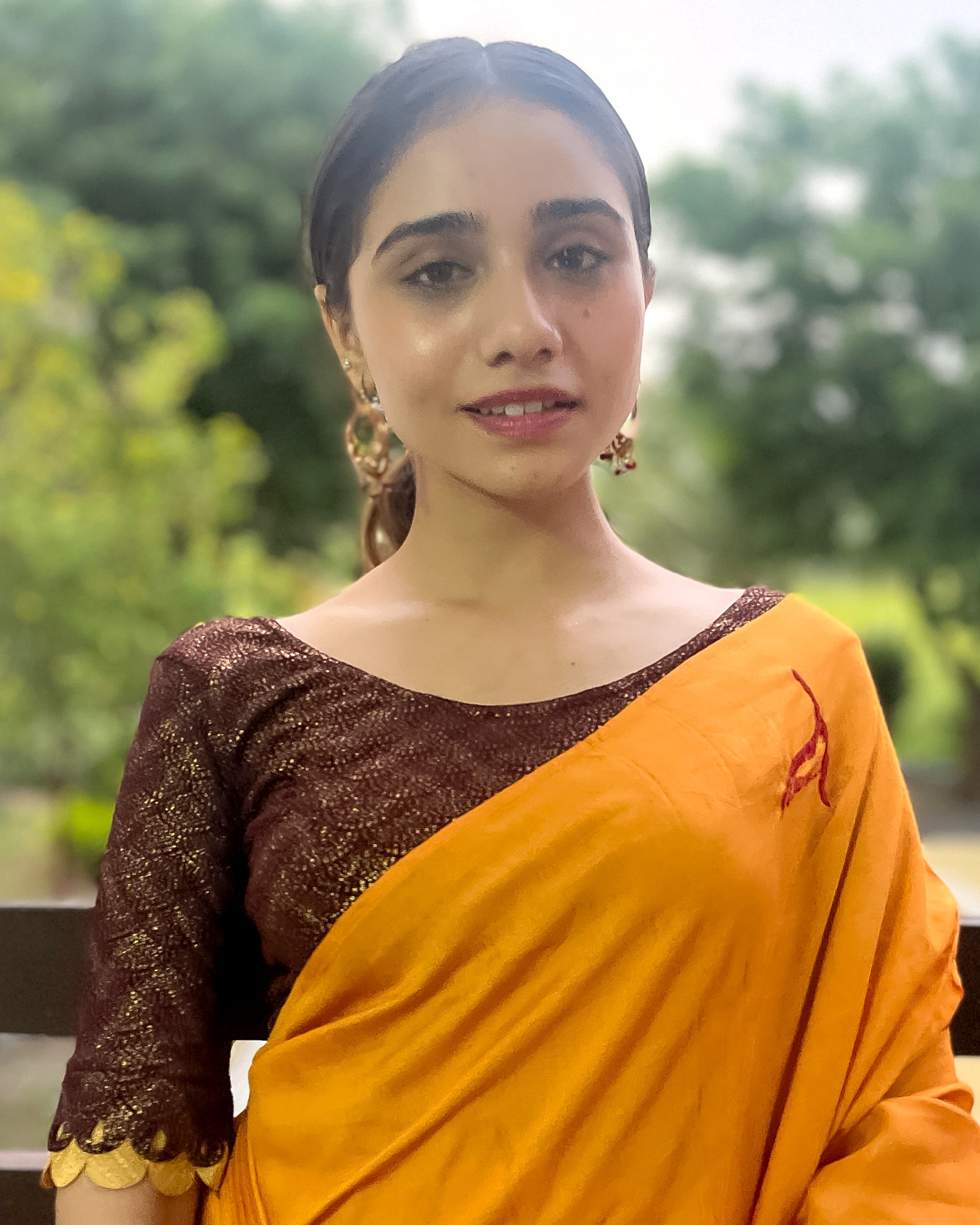 Model pairing the blouse with a saree for a festive look.