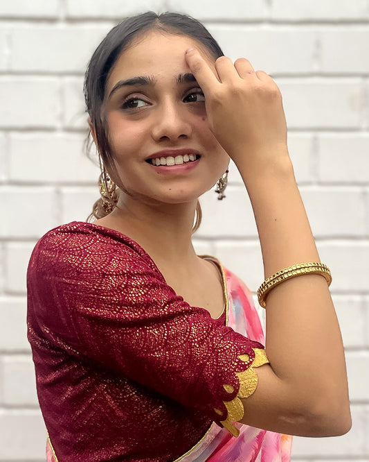 Model pairing the blouse with a saree for a festive look.