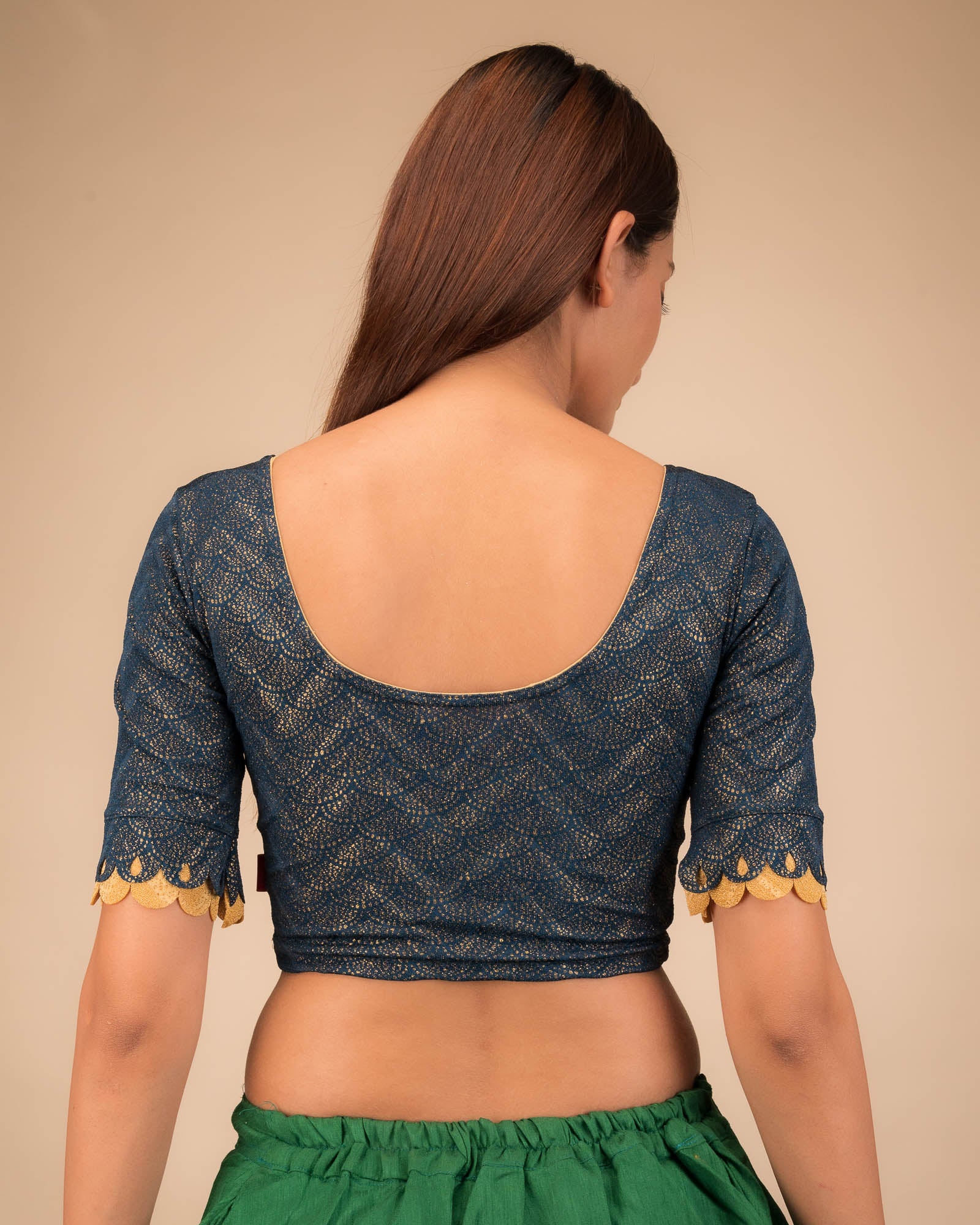  Rear view highlighting the scallop sleeve detail.
