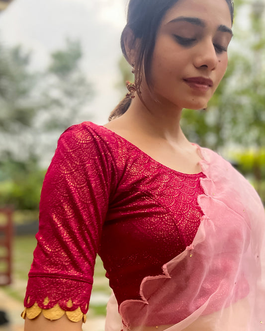 Model pairing the blouse with a saree for a festive look.