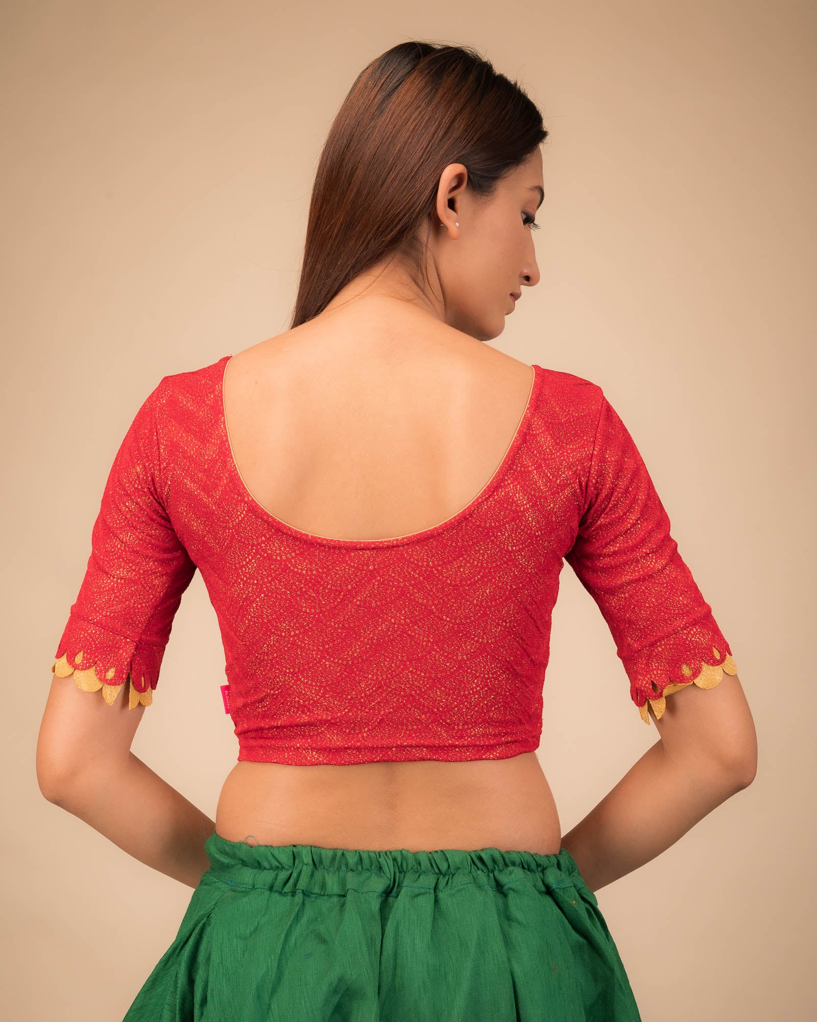Rear view highlighting the scallop sleeve detail.