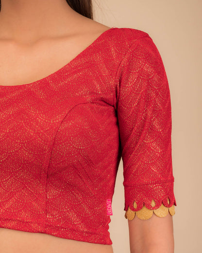 Close-up of the jacquard knit fabric with metallic scallop detailing.