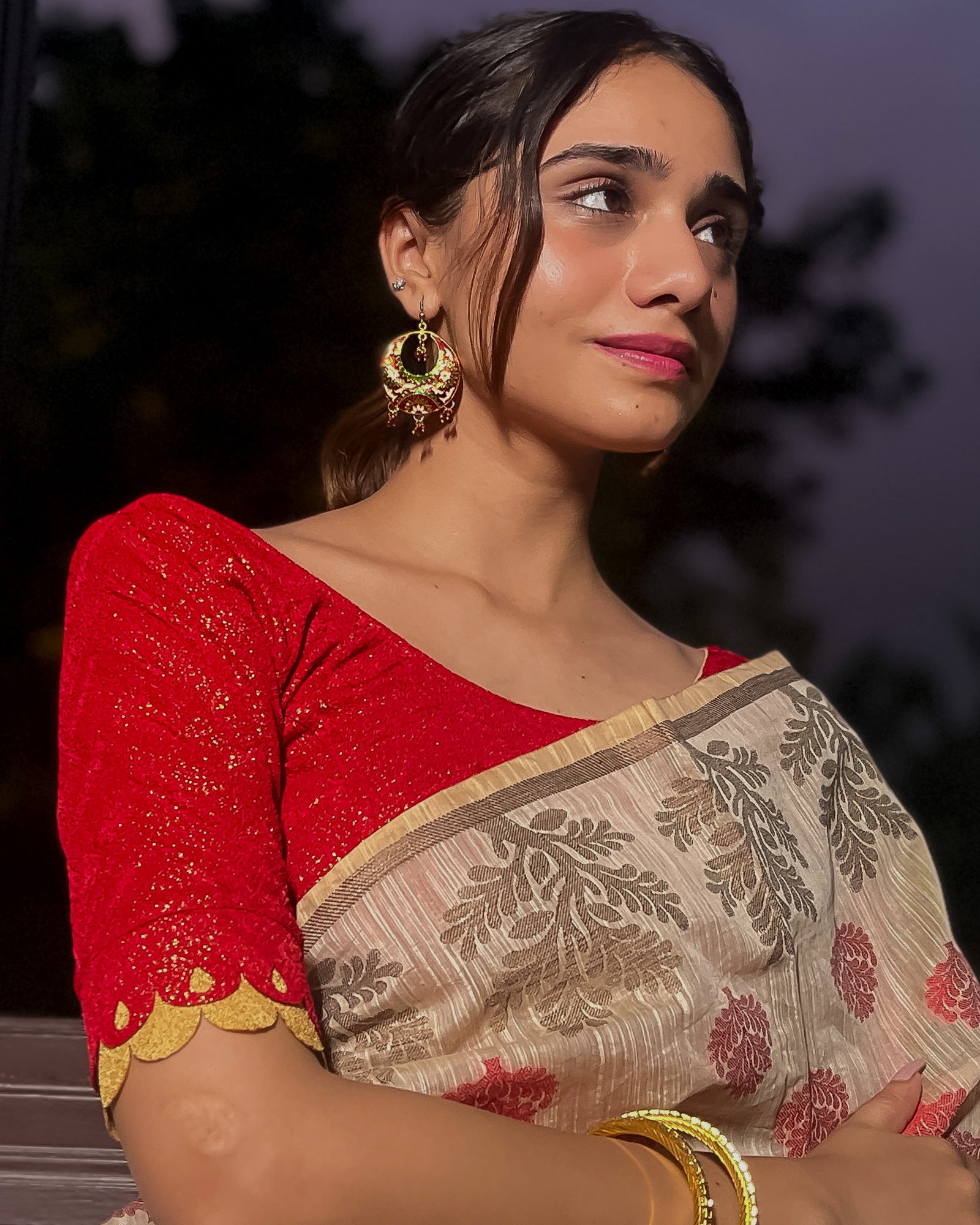 Model pairing the blouse with a saree for a festive look.