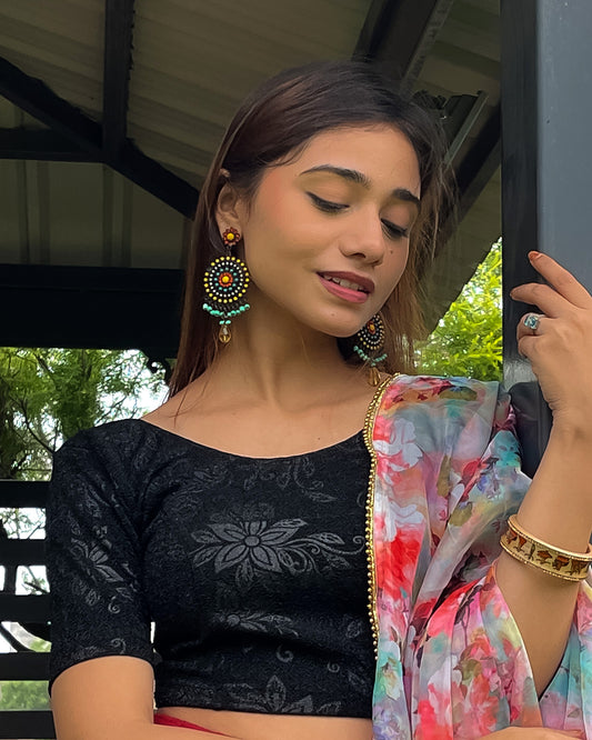Model pairing the blouse with a saree, demonstrating a festive-ready ensemble.
