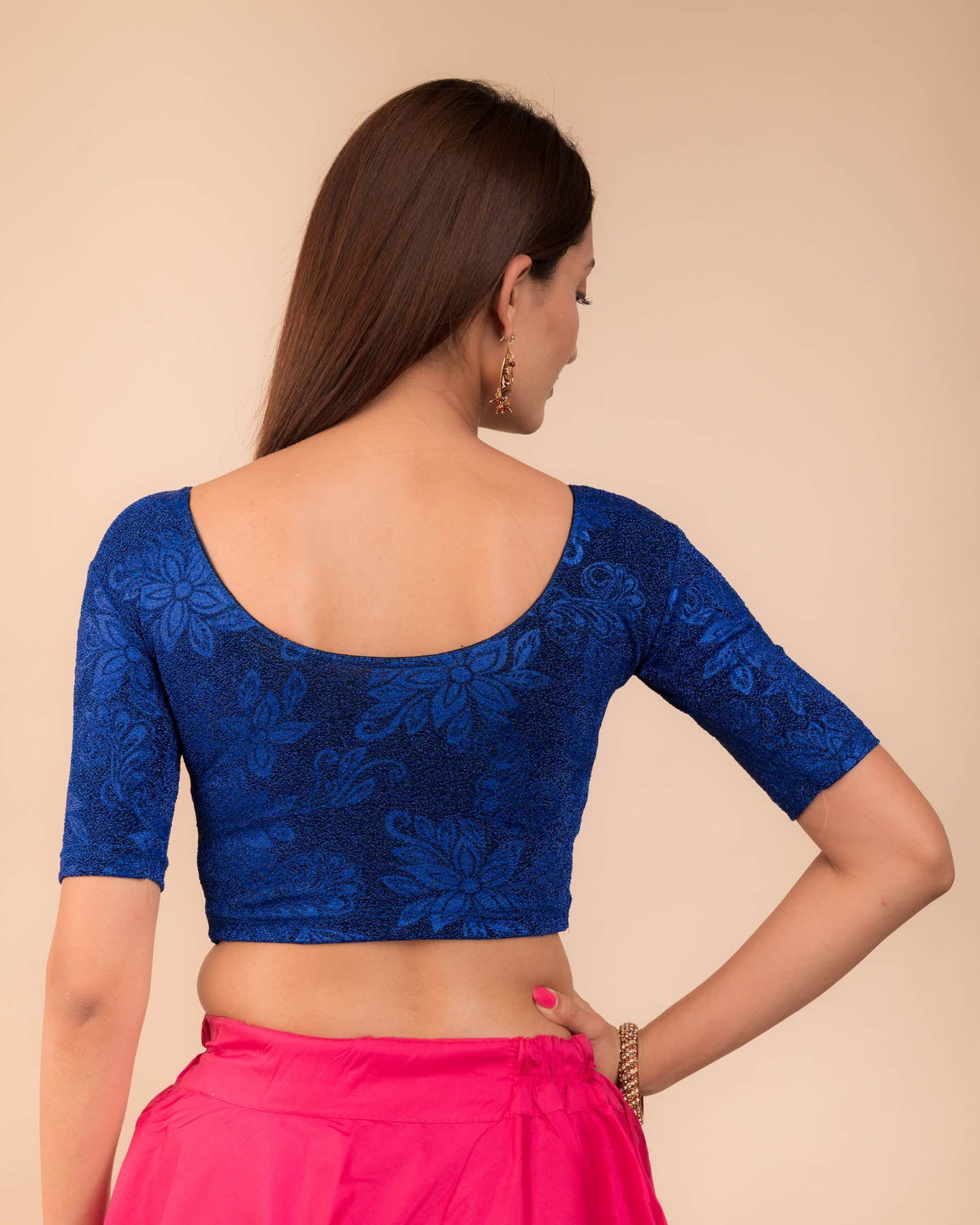 Rear view showcasing the metallic embossed pattern on the fabric.