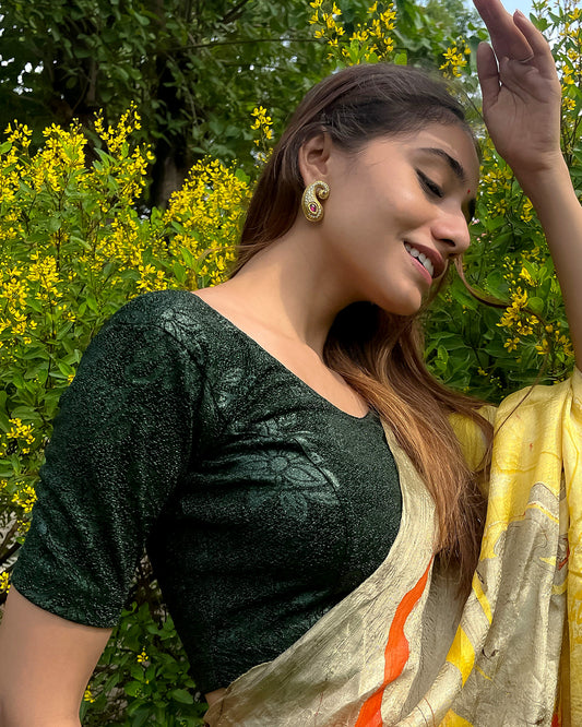 Model pairing the blouse with a saree, demonstrating a festive-ready ensemble.