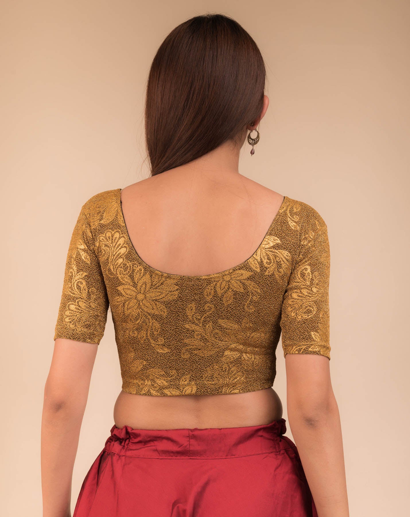 Rear view showcasing the metallic embossed pattern on the fabric.