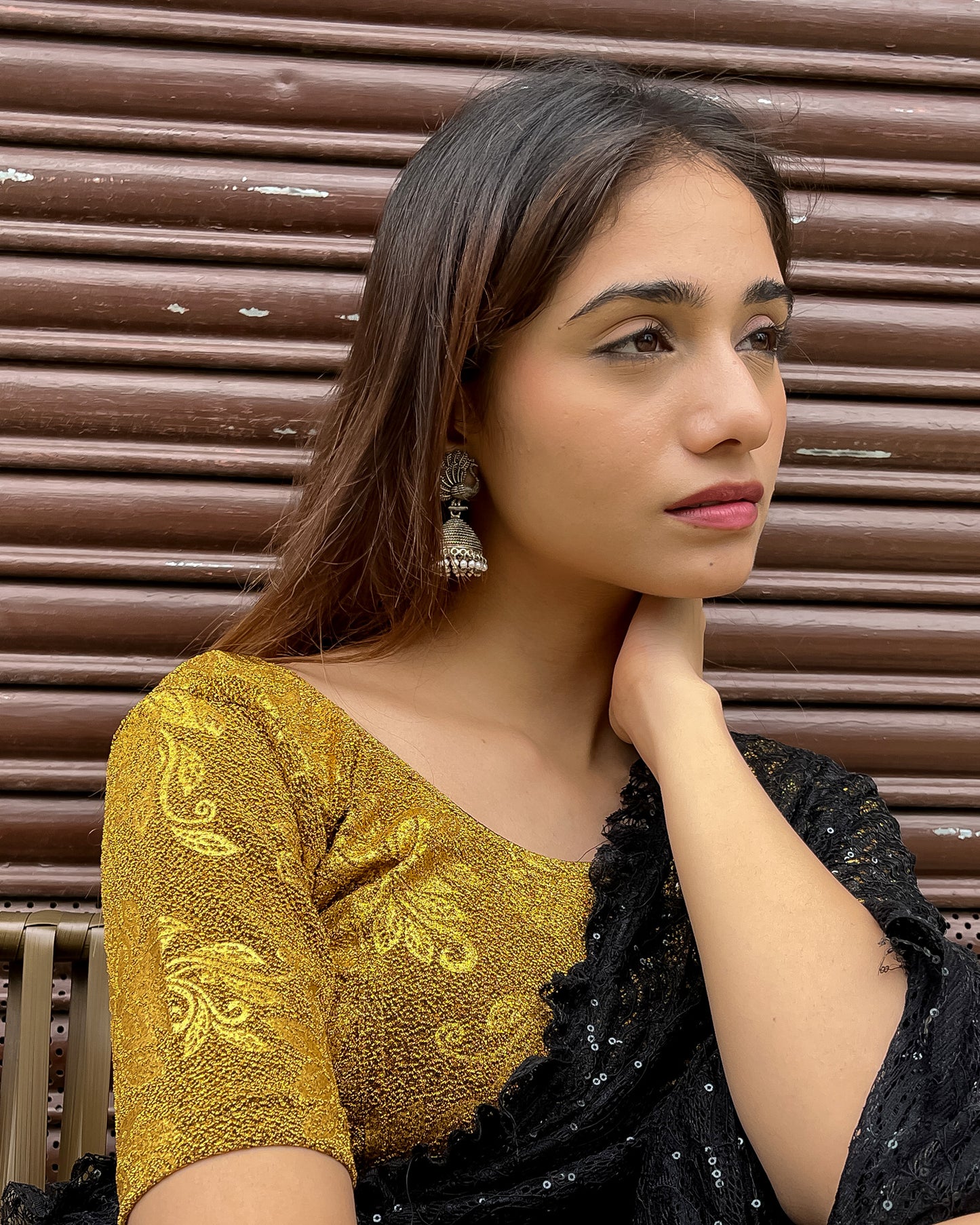  Model pairing the blouse with a saree, demonstrating a festive-ready ensemble.