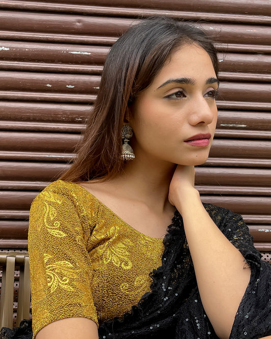  Model pairing the blouse with a saree, demonstrating a festive-ready ensemble.