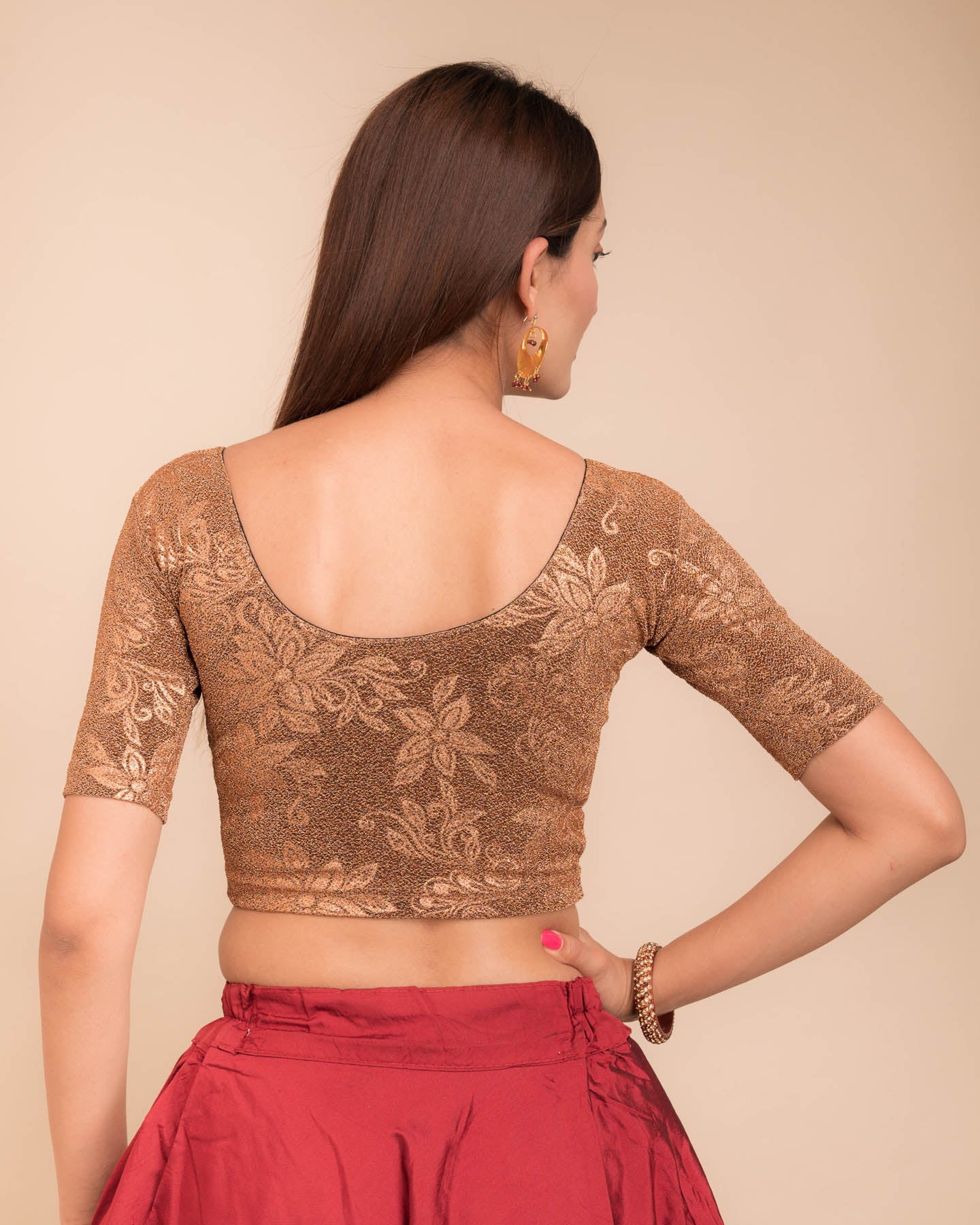 Rear view showcasing the metallic embossed pattern on the fabric.