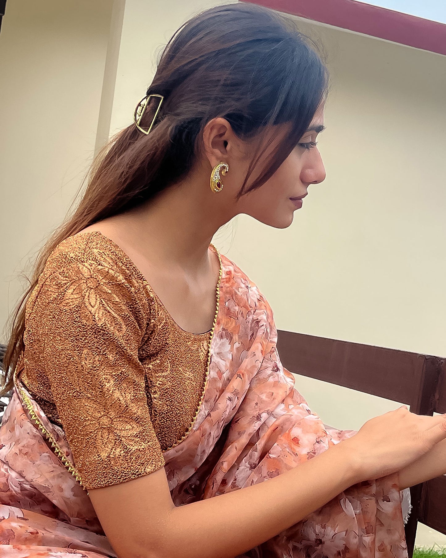 Model pairing the blouse with a saree, demonstrating a festive-ready ensemble.
