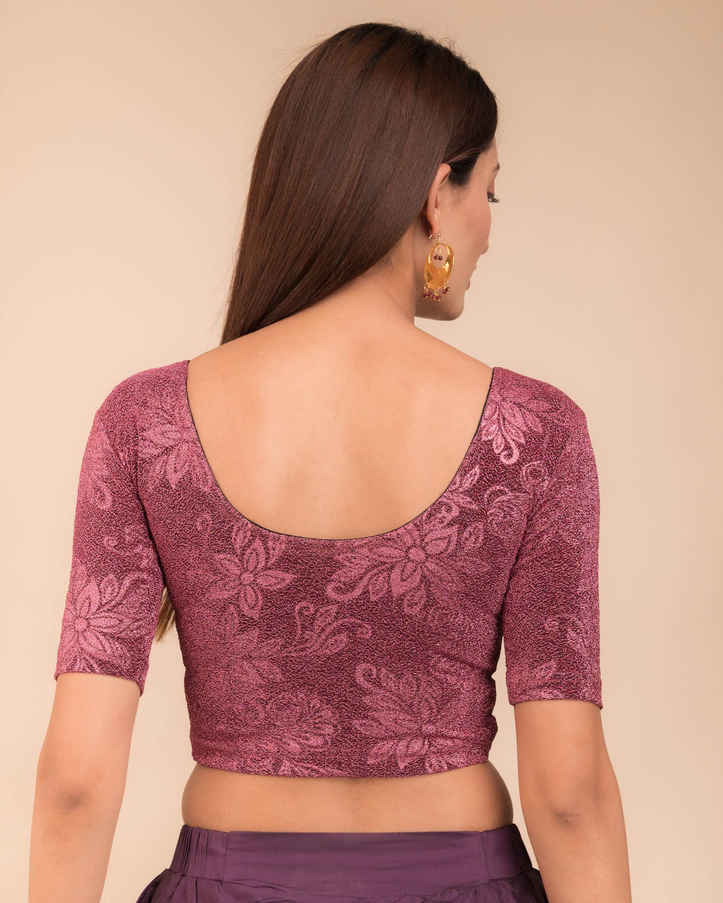 Rear view showcasing the metallic embossed pattern on the fabric.