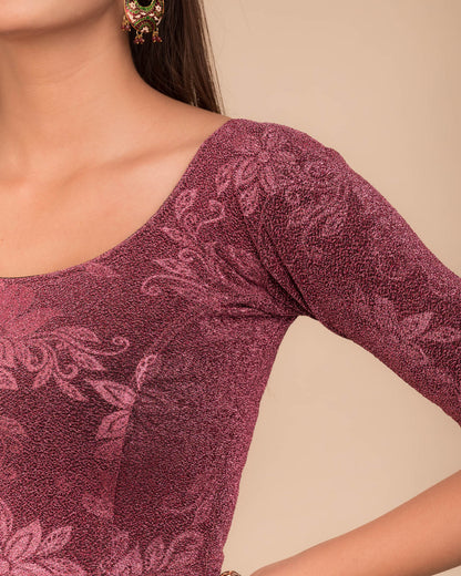 Close-up of the embossed metallic texture on stretchable knit fabric.