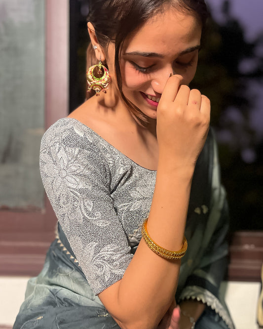 Model pairing the blouse with a saree, demonstrating a festive-ready ensemble.
