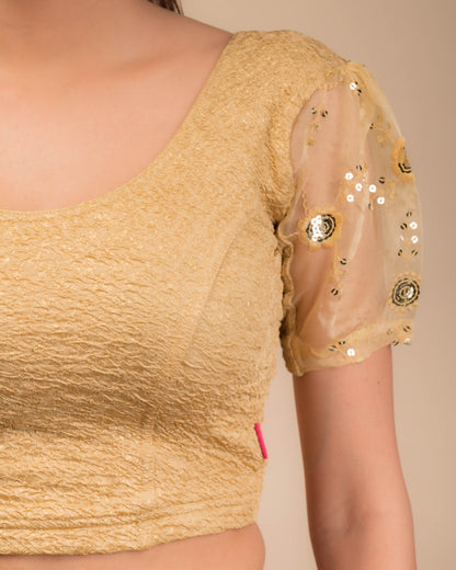  Close-up of textured bodice with sequin embroidery.