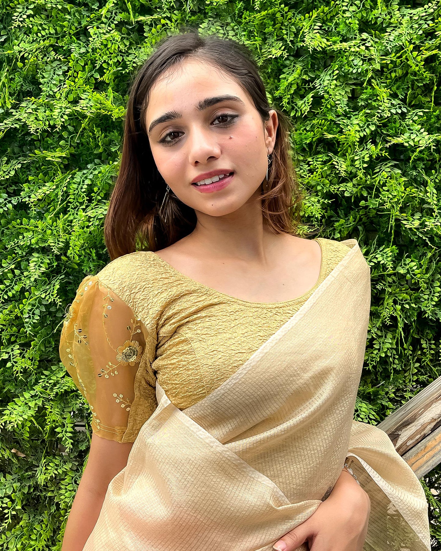 Model paired with a saree for a festive-ready look.