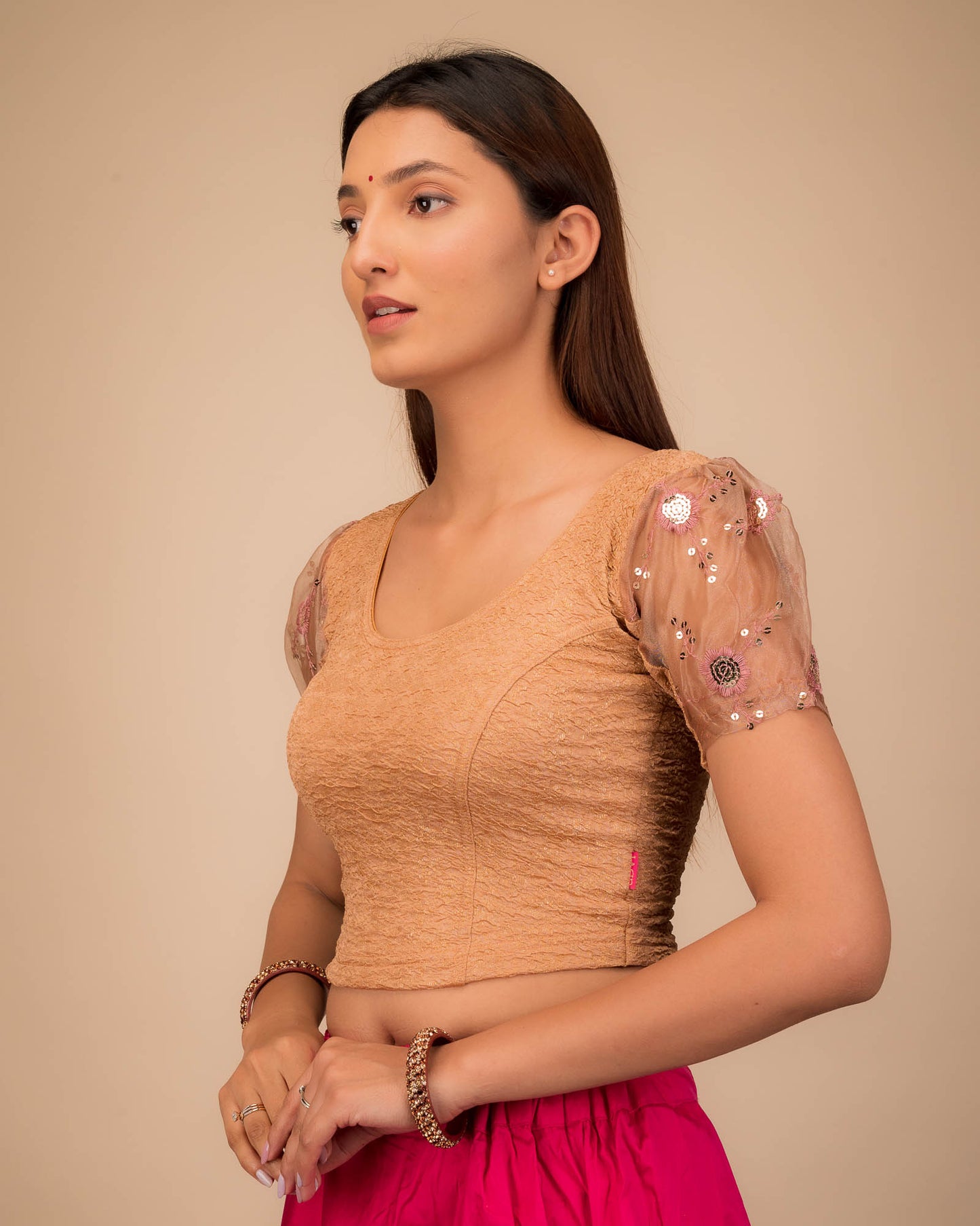 Side profile highlighting sleeve volume and fit.