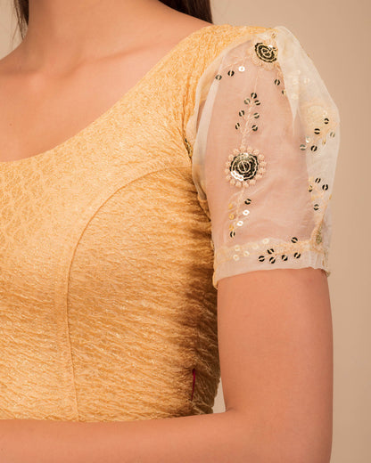Close-up of textured bodice with sequin embroidery.