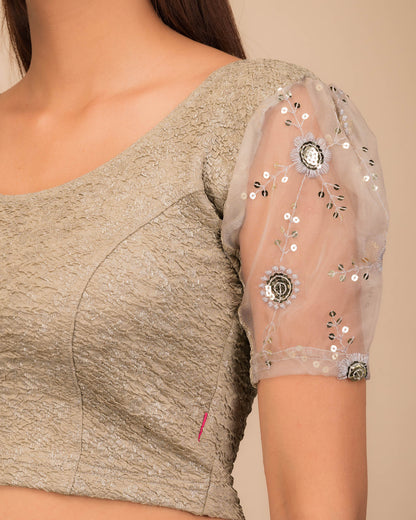 Close-up of textured bodice with sequin embroidery.