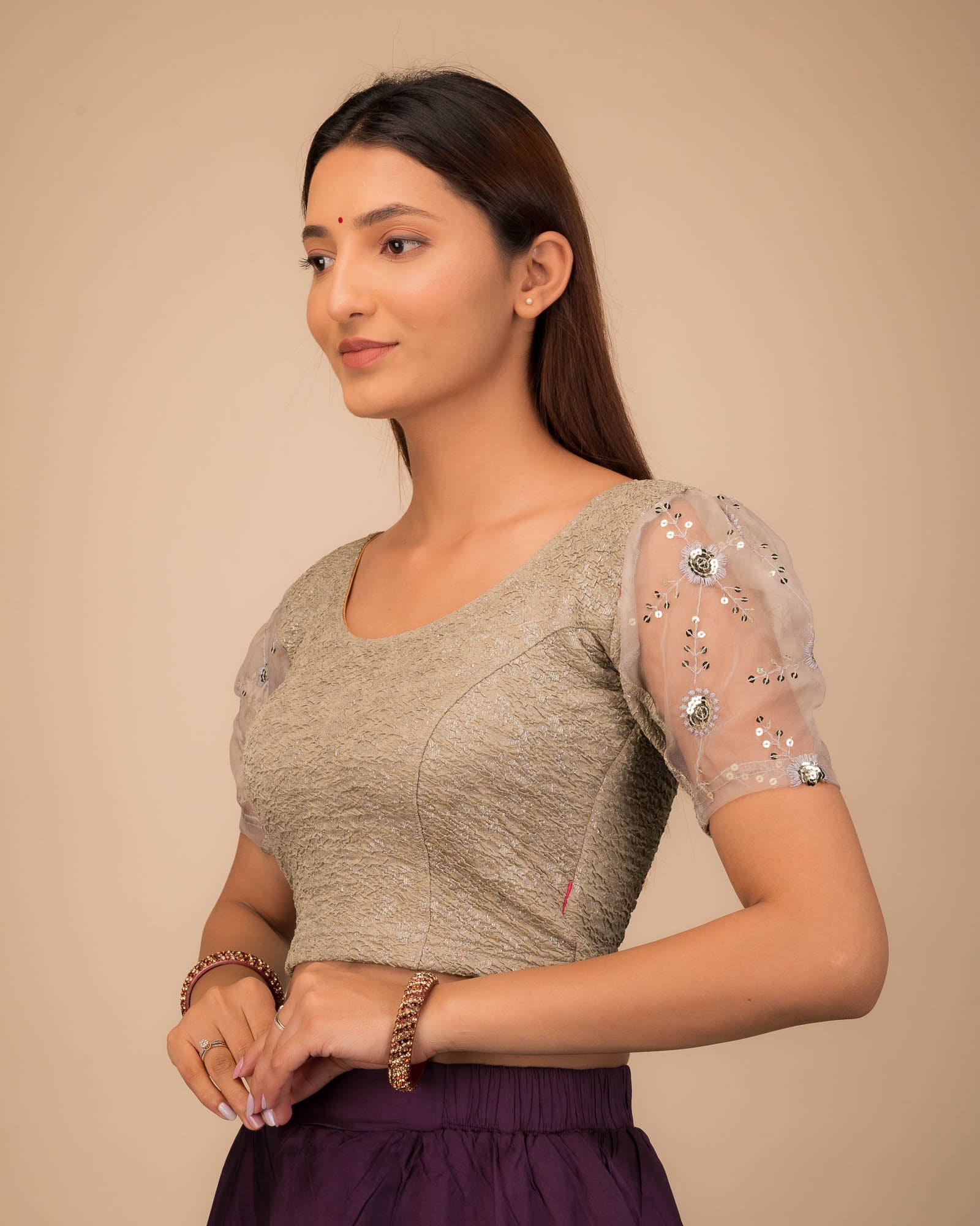 Side profile highlighting sleeve volume and fit.