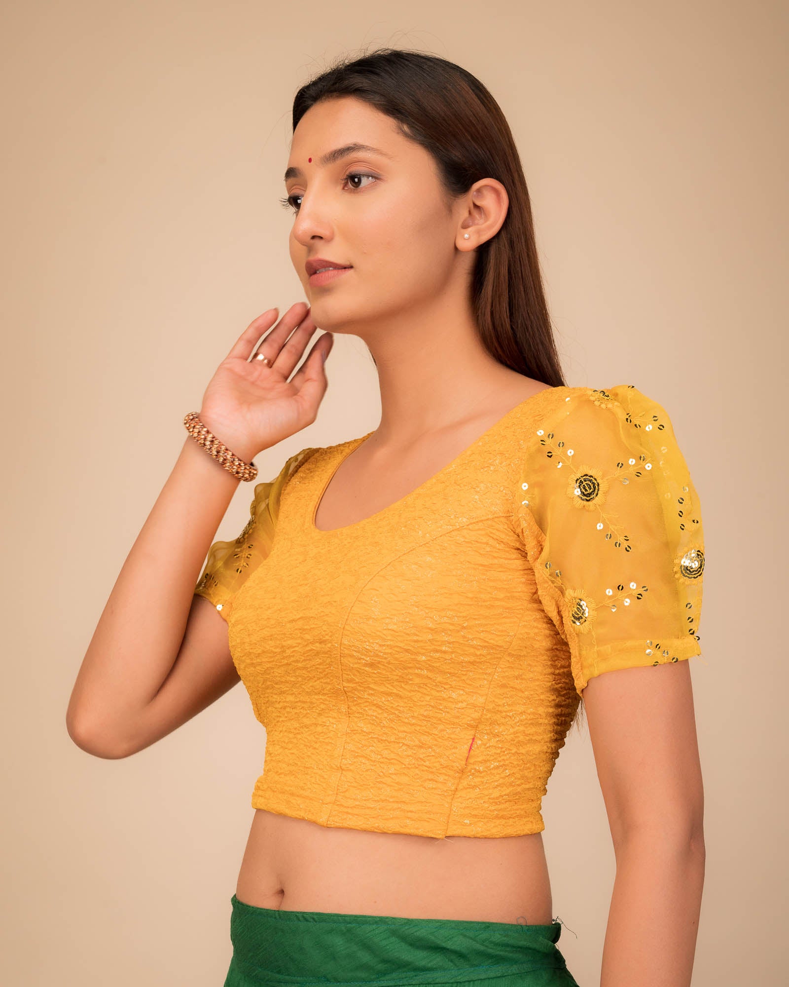 Side profile highlighting sleeve volume and fit.