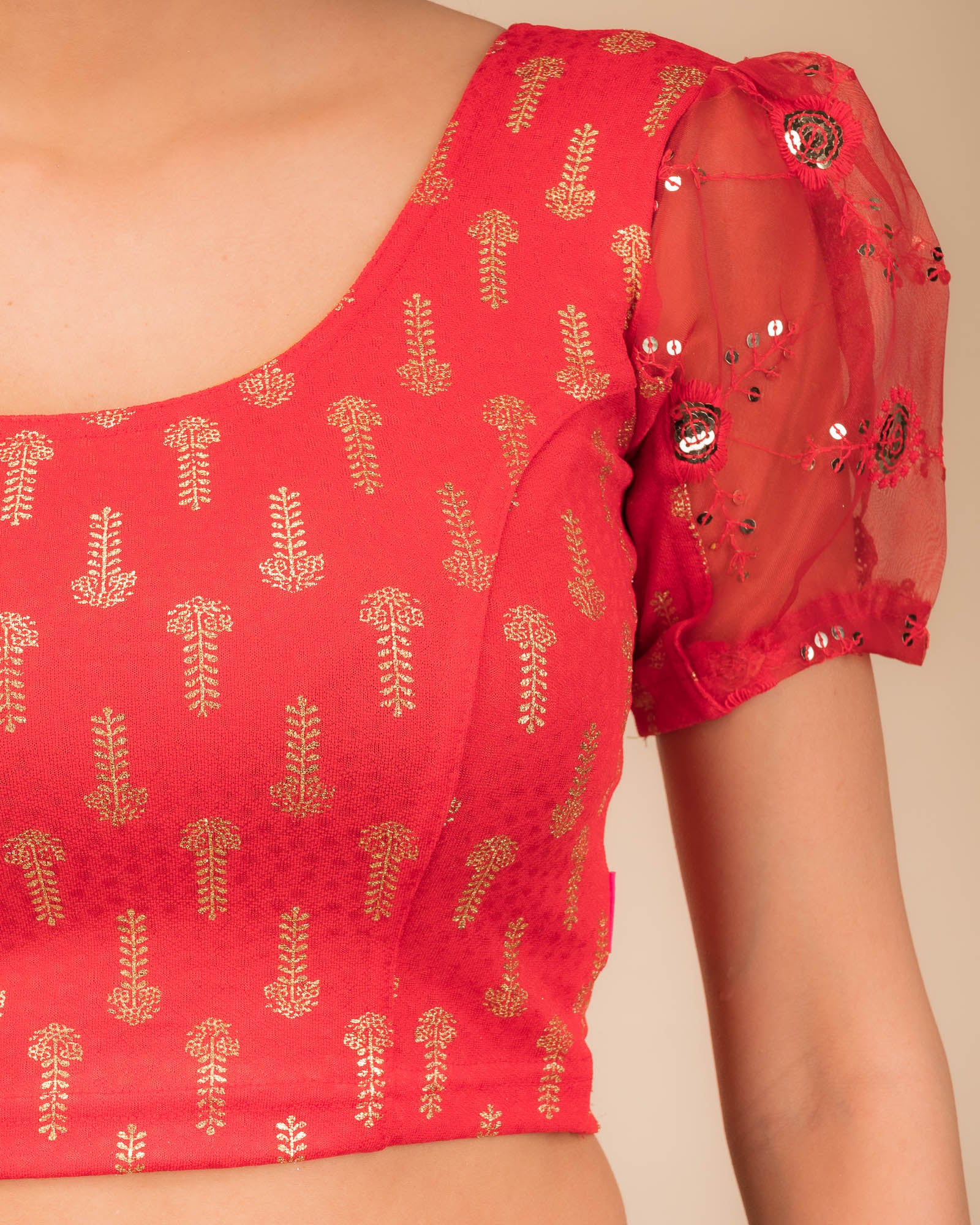 Close-up of textured bodice with sequin embroidery.