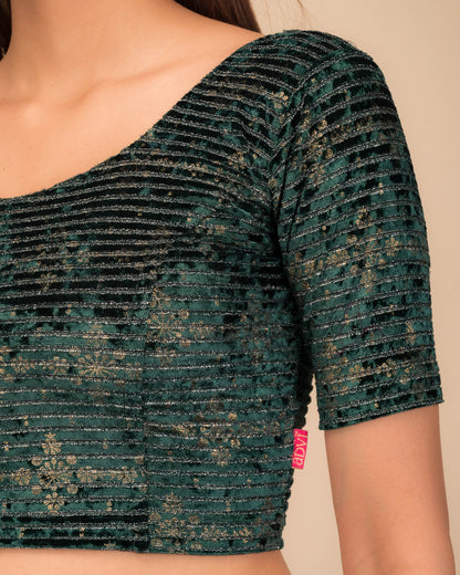 Close-up of velvet fabric with metallic foil embellishment.
