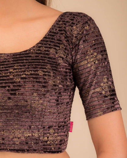 Close-up of velvet fabric with metallic foil embellishment.