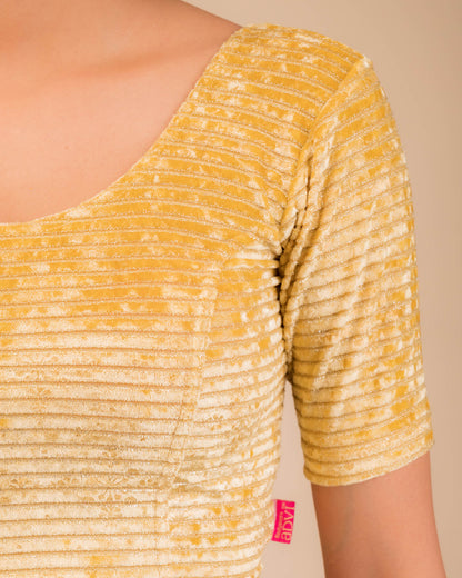 Close-up of velvet fabric with metallic foil embellishment.

