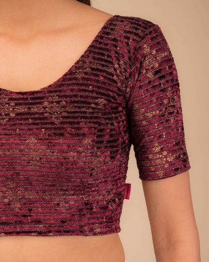 Close-up of velvet fabric with metallic foil embellishment.