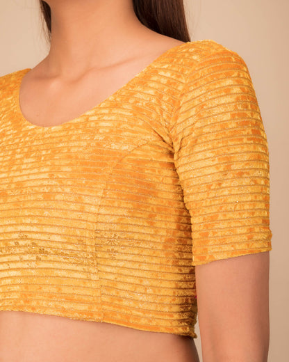 Close-up of velvet fabric with metallic foil embellishment.