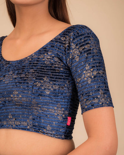 Close-up of velvet fabric with metallic foil embellishment.