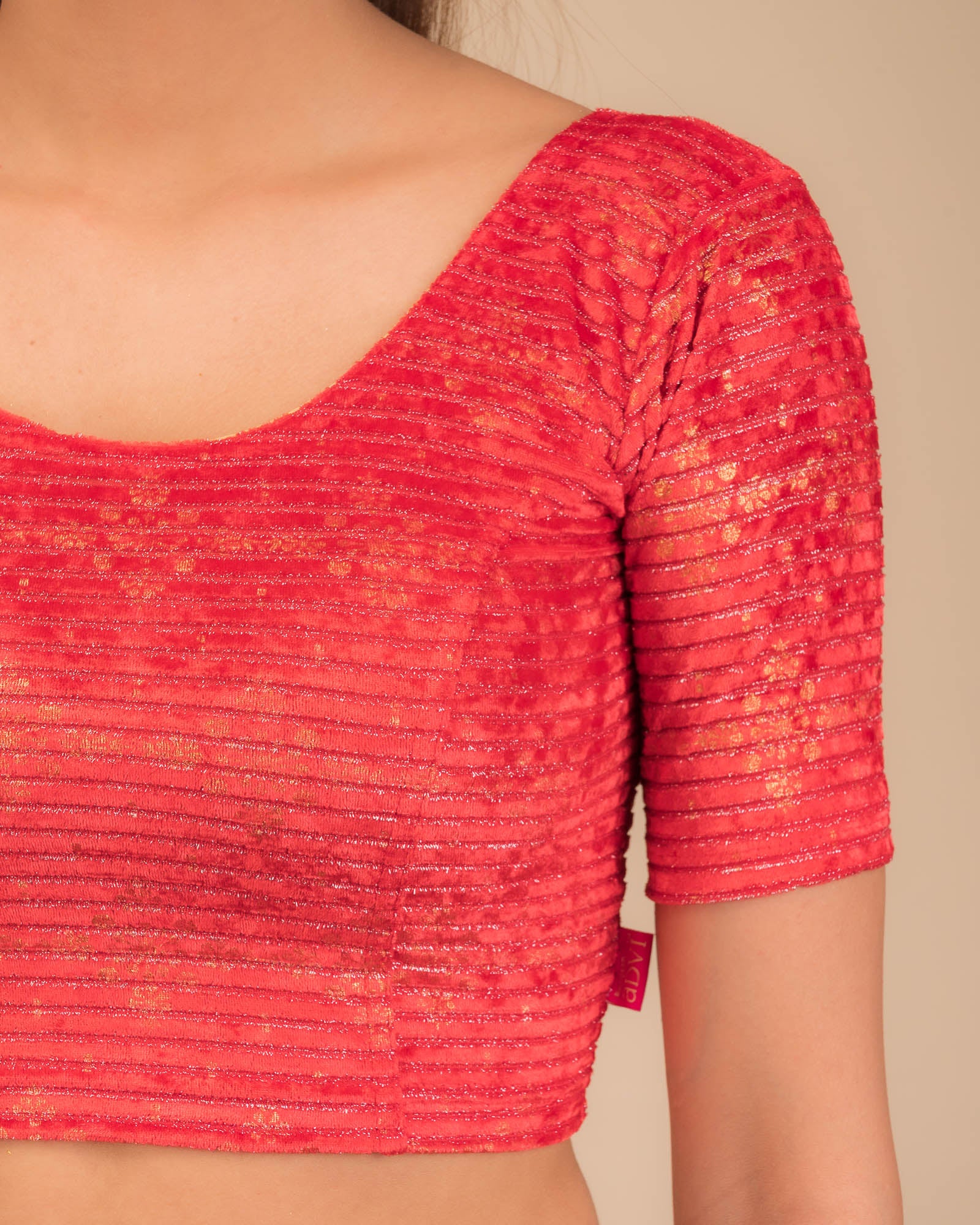 Close-up of velvet fabric with metallic foil embellishment.