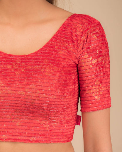 Close-up of velvet fabric with metallic foil embellishment.