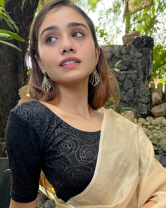 Model pairing the blouse with a saree for a festive ensemble.